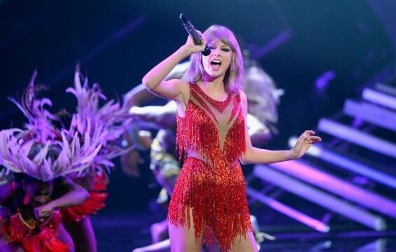 Taylor Swift Brings Out Wiz Khalifa in Houston for ‘See You Again’